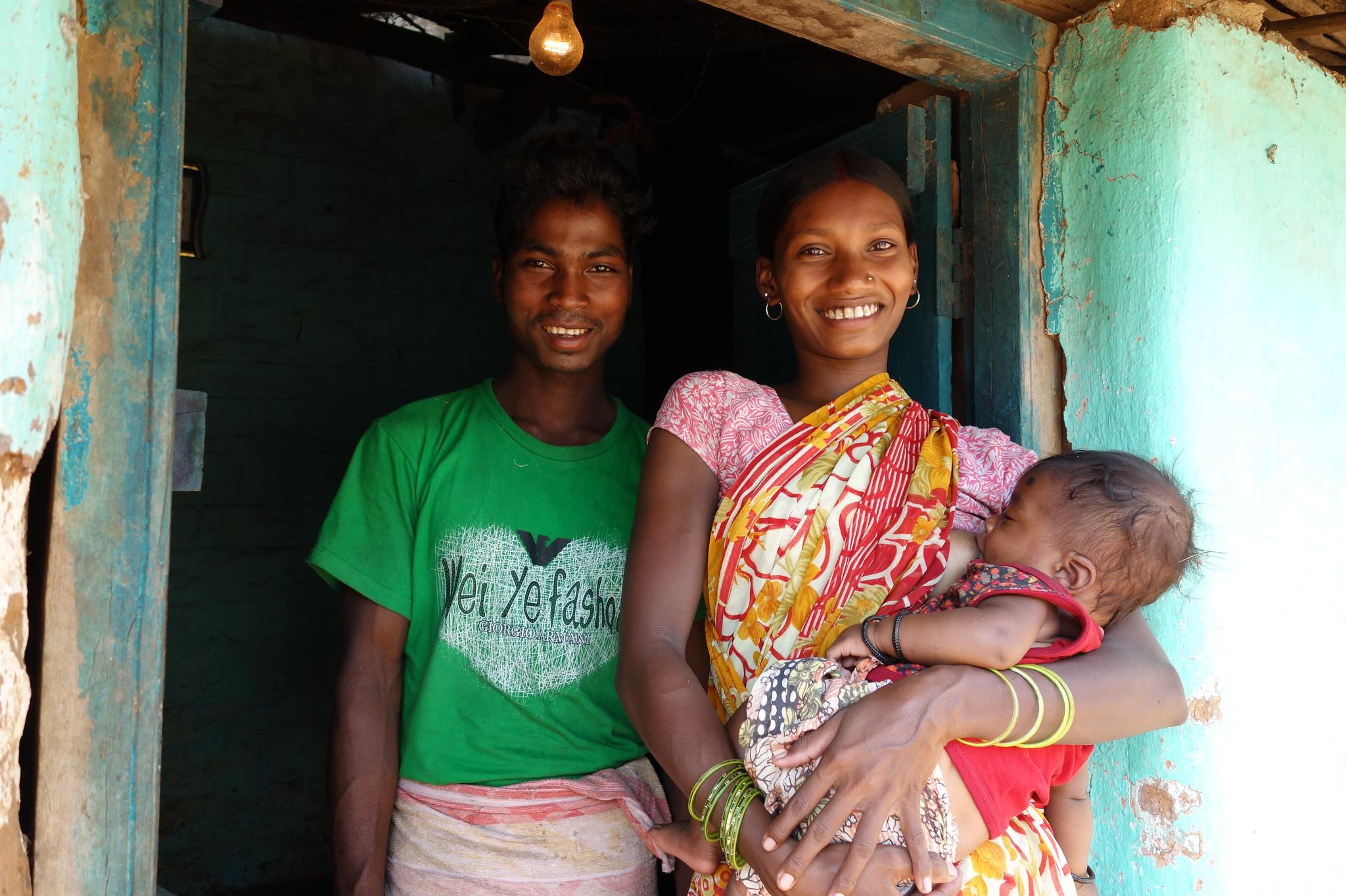 Indian girl and boy holding baby