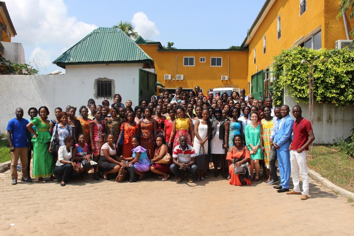 Group of PMA data collectors and trainers standing in front of building