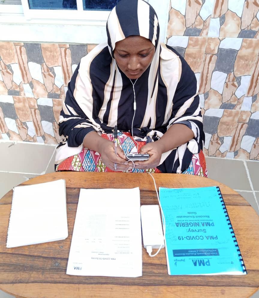 Nigerian woman at table with documents