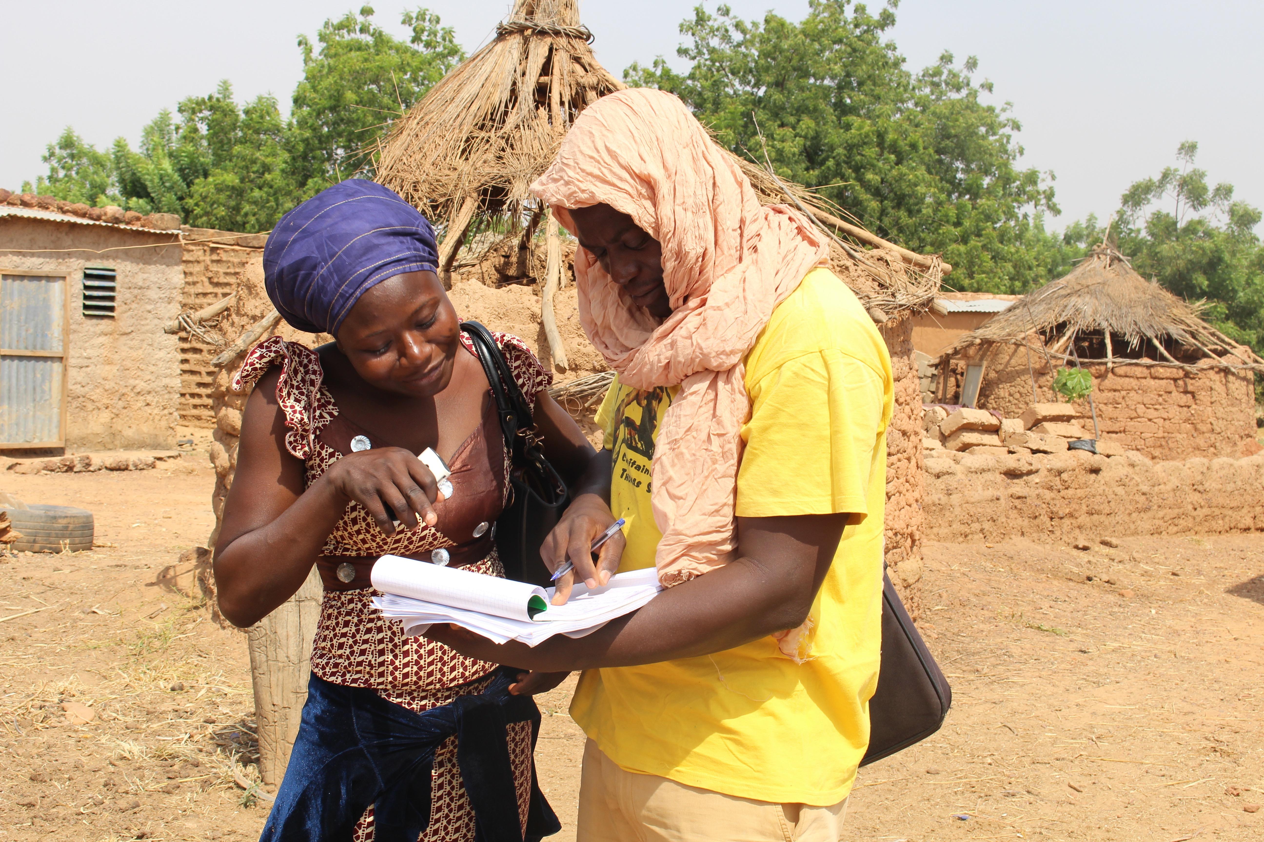 Two people working together outside in Burkina Faso